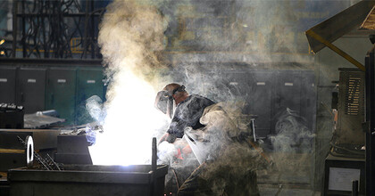 Welder covered in smoke