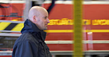 marshfield_fire_department_teaser-fire-fighter-walking-in-front-of-fire-truck-and-exhaust-extraction-hose