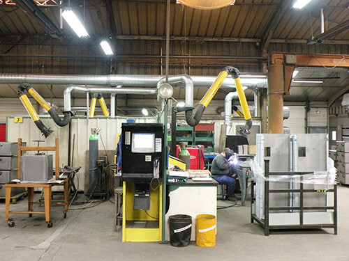 Multiple KUA extraction arms in a welding workshop