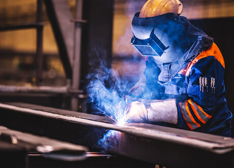 Welder welding a construction