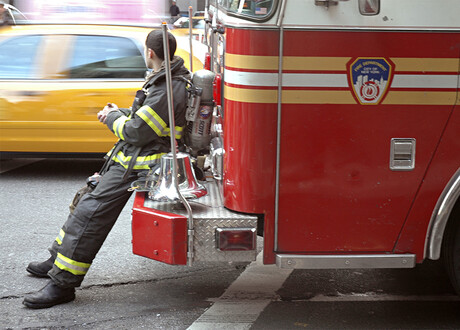 Firefighter sitting on fire truck